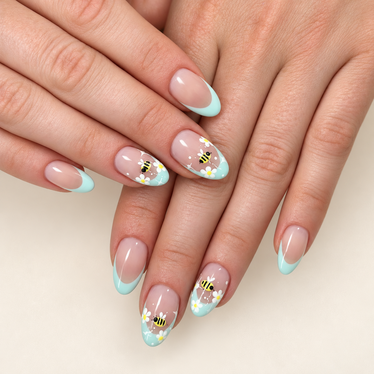 Mint French manicure with bee and daisy nail art